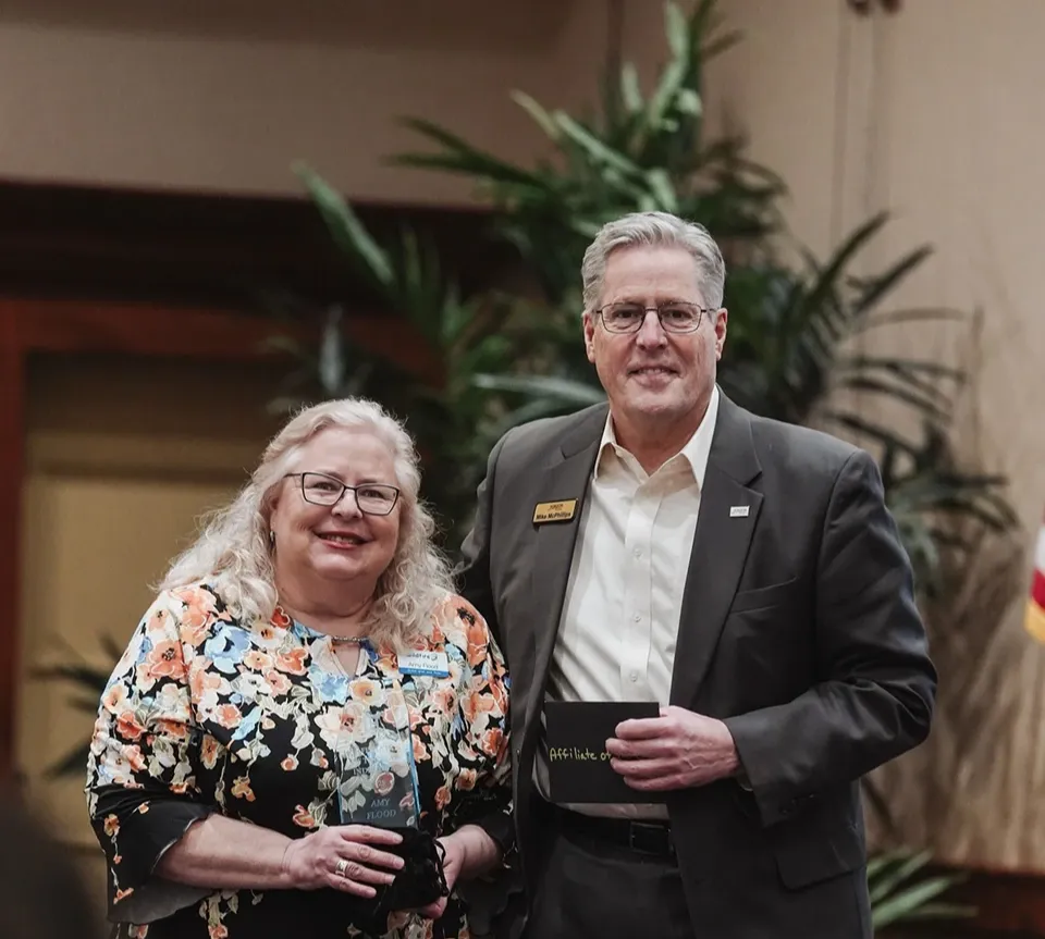 Amy flood receiving award