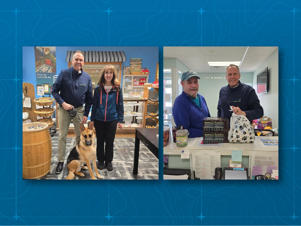 David Satek posing with local businesses with gifts for small business month.