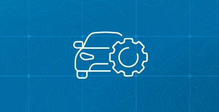Car icon with a gear icon to the right with blue grid background
