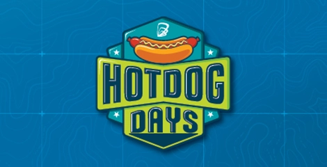 Green and teal Hot Dog Days logo over blue background.