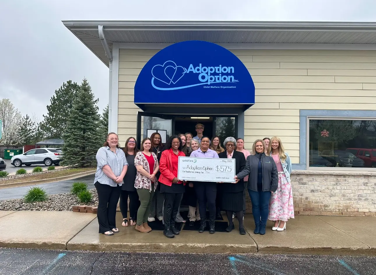 Wildfire presents Midland Adoption Option with check for $575.