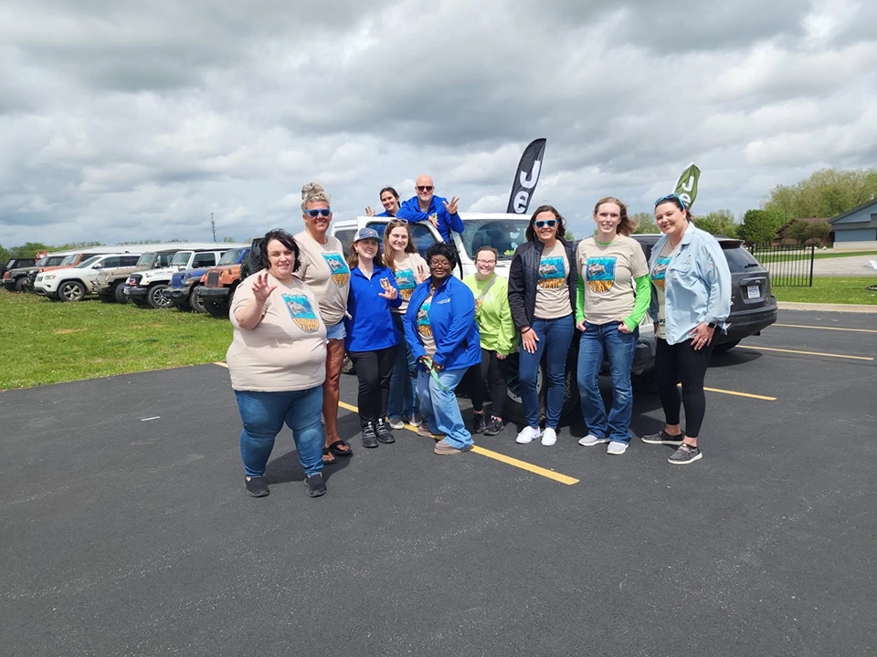Wildfire employees smiling at Jeep Freedom Ride event.