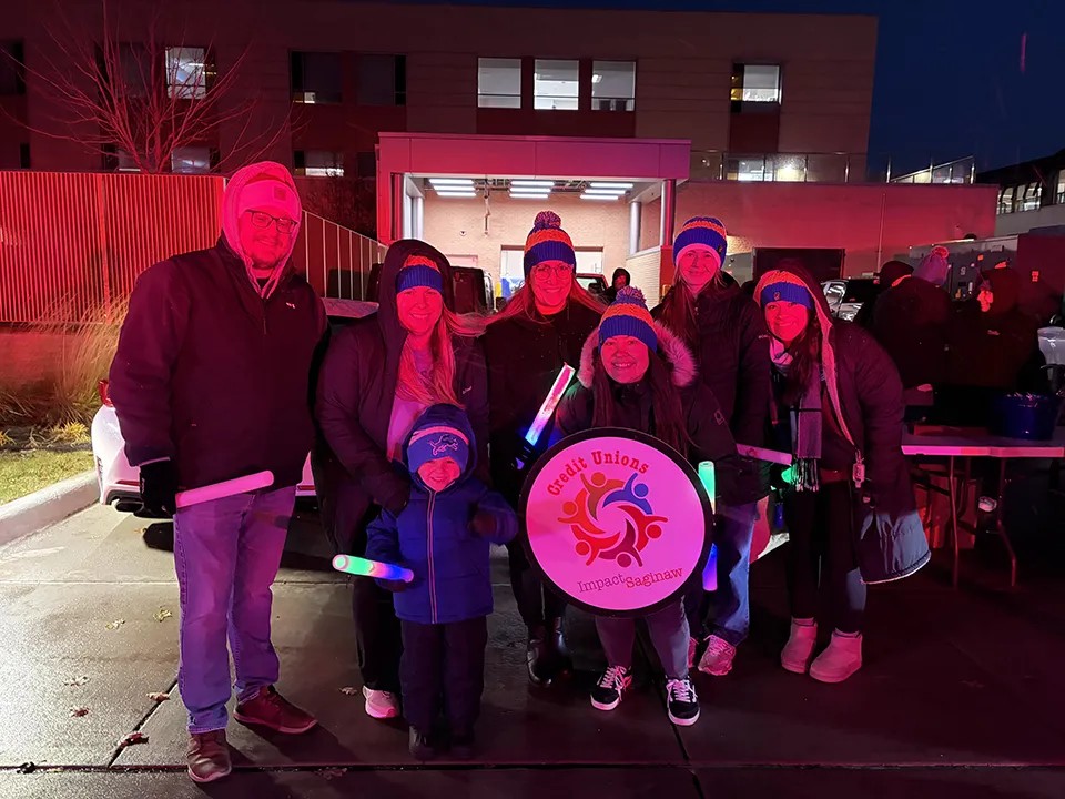 Wildfire employees and family stand outside of Covenant Hospital for kids at Christmas lighting.