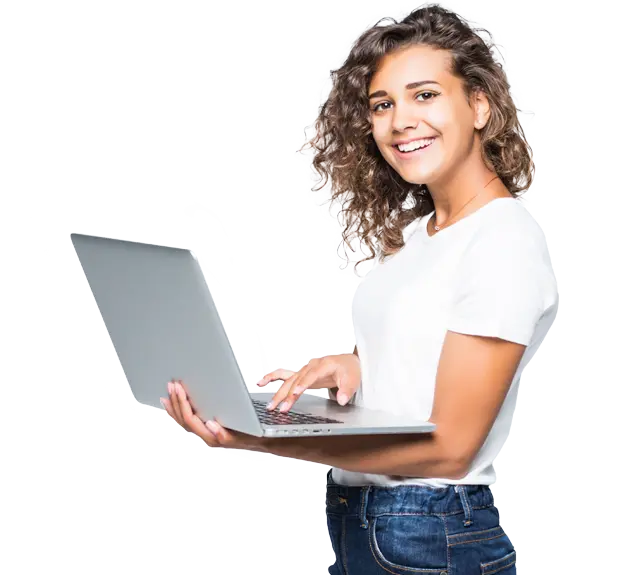 Smiling woman holding a laptop, standing and looking at the camera.