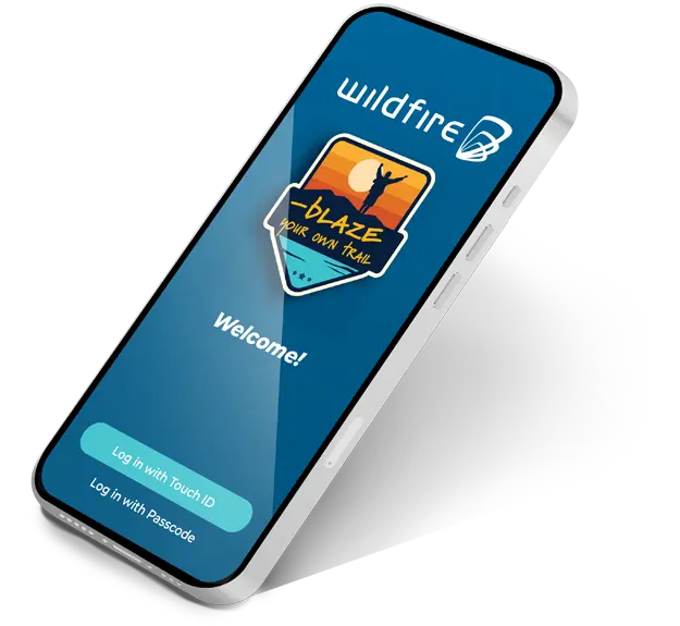 Cell phone with login screen to the Wildfire banking app showing.