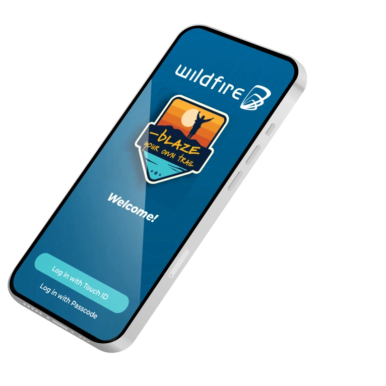 Cell phone with login screen to the Wildfire banking app showing.