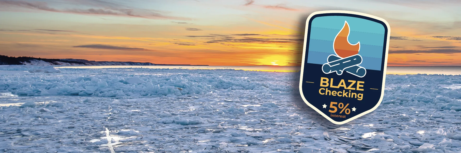 Blaze Checking badge with 5% interest with a background of Lake Michigan winter sunset.