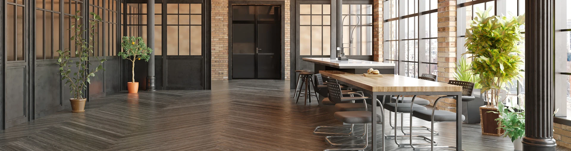 Clean open office setting with old brick factory and window panes with natural light and green plants