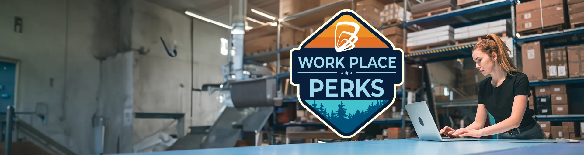 Woman working on a laptop in a warehouse with Workplace Perks badge overlay.