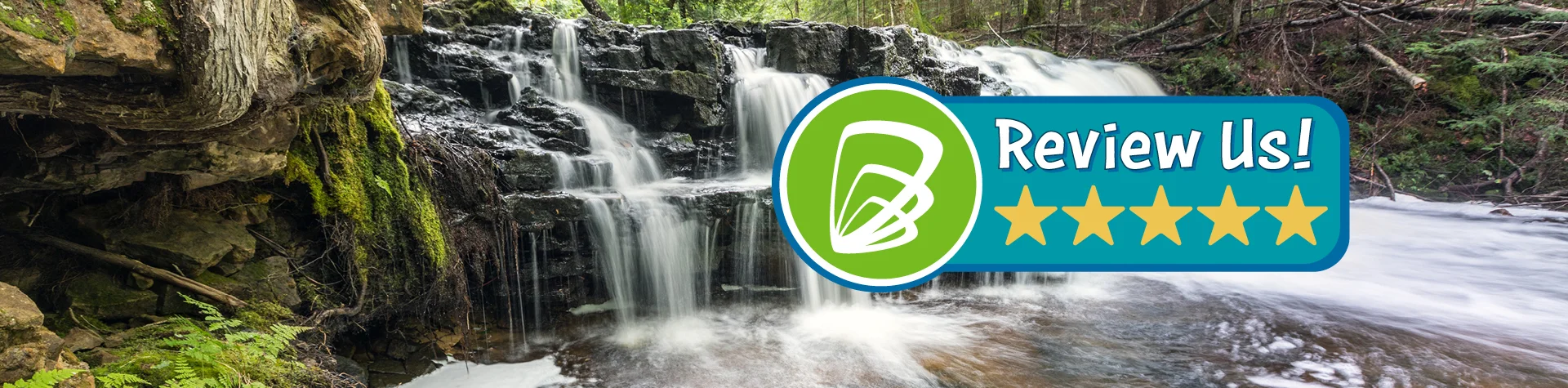 Review us display text banner with waterfall flowing in thick woods as a background.