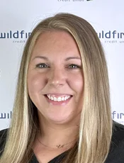 Dealer indirect loan officer Maggie Kerns headshot on Wildfire background.